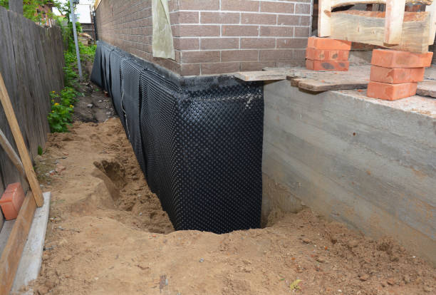 Happy homeowners after waterproofing job in Petersburg
